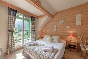 Master bedroom with access to balcony and office area