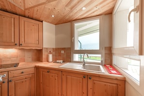 Fully equipped self-contained kitchen with lake view