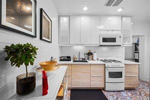 Modern kitchen with character and charm—fully functional and stocked with all the basics you’ll need for your stay