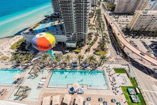Relax and unwind in the refreshing outdoor pool, perfect for enjoying the sun and cooling off.