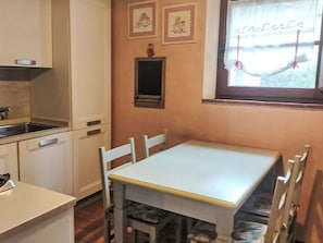 Furniture, Interior Design, Flooring, Wood, Floor, Kitchen & Dining Room Table, Kitchen, Kitchen Appliance, Room, Major Appliance