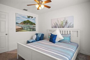 This king bedroom includes a smart TV & comfy twin pull-out sleeper chair