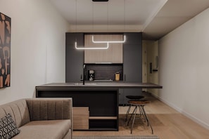 Compact modern kitchen and cozy dining booth