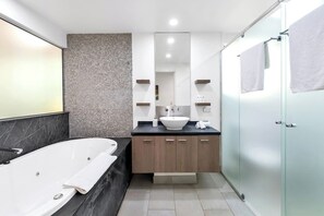Soak the day away in your private spa bath or step into the glass shower, all within the calming ensuite retreat.