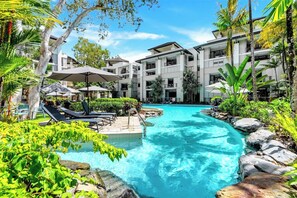 Float through the lagoon-style pool surrounded by tropical foliage, where every corner invites you to pause and let go.