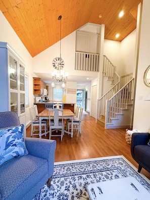 View of enclosed loft and open dining room.