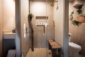 Spa-Like Bathroom: Experience nature-inspired luxury with a rain shower and serene wooden accents!