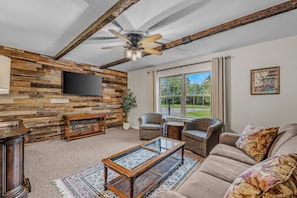 Large living area with a smart TV.