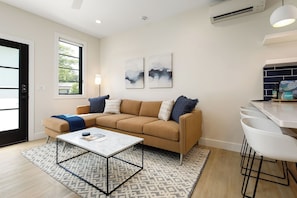 Enjoy downtime in this beautifully designed living room, complete with a smart TV and chic decor.