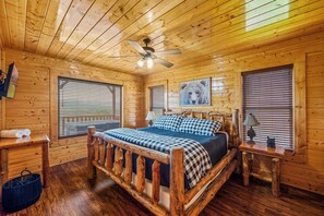 Wake up to mountain views from this cozy king bed with cabin charm