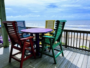 Oceanfront deck seating - perfect for morning coffee or sunset wine.