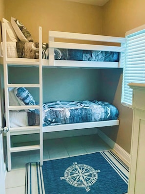 Twin over twin bunk beds, TV in the bunk room & a full bath across the hall.