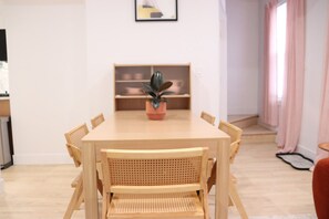 Extendable dining table in the living area — great for takeout, coffee, or casual meals