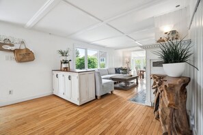 The living area! Plenty of seating for everyone, with a smart tv and comfy couch!