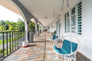 Enjoy the fresh air and lush surroundings from your private balcony.