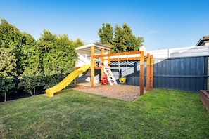 Playground with swing set, monkey bars and slide. Great for kids of all ages!