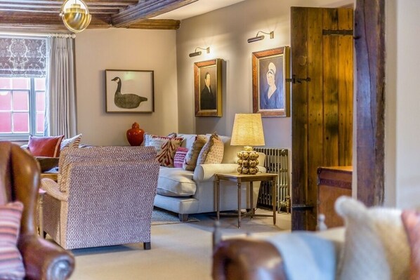 Beautifully presented living room with log burner.