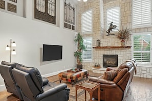 With an air of elegance and sophistication, this living room’s plush couches and warm decor will welcome you in with open arms! Come sit and stay a while!