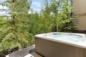 Bask in bubbling bliss with serene views in the private hot tub