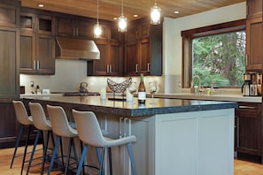 The chic, open kitchen offers ample space & every home comfort