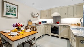 Embracing the country cottage style, the traditional shaker-style kitchen will suit your needs