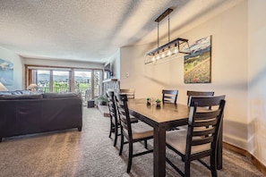 Cozy dining space with plenty of natural light and a stunning balcony view — perfect for meals with a breeze and a view!