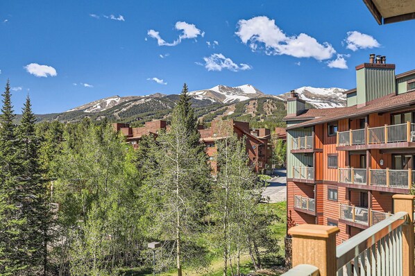 Relax on the balcony with comfortable seating and breathtaking views of the town and mountains — your perfect spot to unwind and soak it all in!