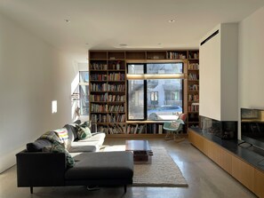 Living with built-in bookcase and gas fireplace
