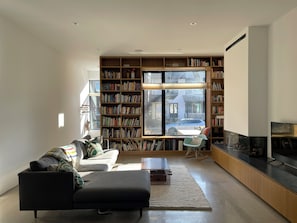 Living with built-in bookcase and gas fireplace