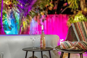 Savor the evening with a glass of wine after a soothing dip in the hot tub.
