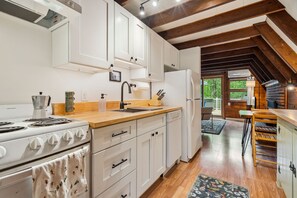 The kitchen is fully equipped with all the essentials, like cookware, plates, moka espresso pot, tea kettle, drip coffee maker, utensils, and a dishwasher! The cabinets are brand new as of 2025!