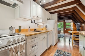 The kitchen is fully equipped with all the essentials, like cookware, plates, moka espresso pot, tea kettle, drip coffee maker, utensils, and a dishwasher! The cabinets are brand new as of 2025!