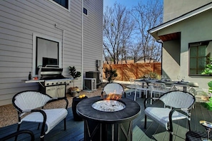 large back patio with grill and gas firepit