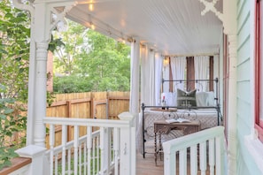 Cozy Queen day bed on the porch.