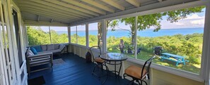 OVERVIEW:  Looking out on Crystal Lake from the gorgeous fully-enclosed front porch.
