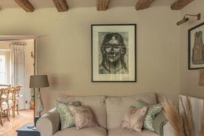Copy sofas with seating focused around the log burner