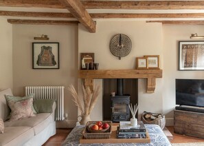Cosy cottage living room with log burner.