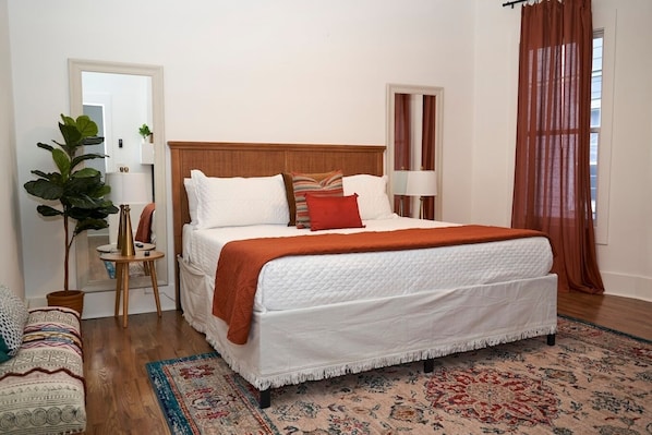 The main bedroom is located on the first level of the property and has it's own large bathroom complete with tub and shower!