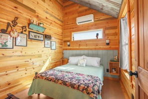 The cabin has two bedrooms with queen beds.