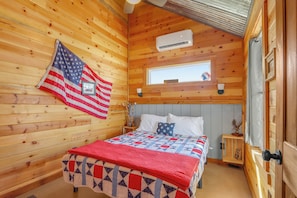 The cabin has two bedrooms each with a queen bed.