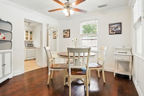 Dining Area – Light-Filled with Layout Flow - This sunny dining nook keeps things simple and sweet—just like life on St. Simons. The space opens to the living room and kitchen, creating a natural flow for meals, card games, or mapping out your next stop (spoiler: it’s probably Frosty’s or the pier). Ceiling fan included for those who run warm.
