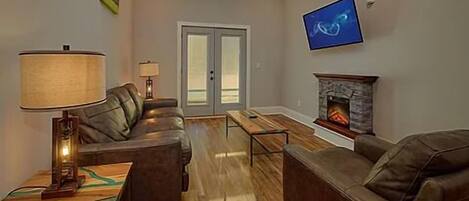 Spacious Living Room with Electric Fireplace and SMART TV with Cable & WIFI throughout vacation rental