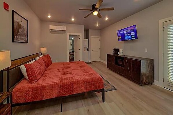 Spacious one-room studio condo with a king bed, tv, microwave, coffee maker and small refrigerator