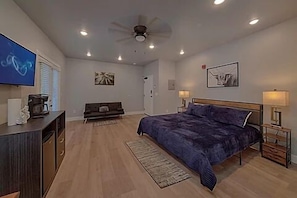 Spacious one room condo has a king bed with tv