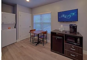 Sitting area with a small refrigerator, microwave, and coffee maker