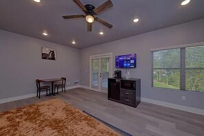 Spacious one room studio condo with king bed, tv, coffee maker, refrigerator and microwave