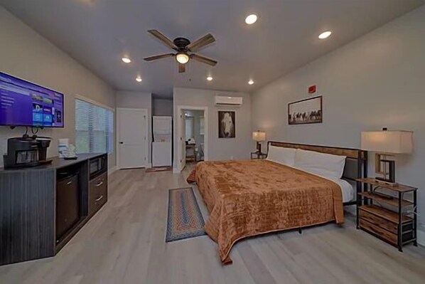 Spacious one room studio condo with king bed, tv, coffee maker, refrigerator and microwave