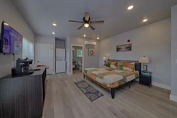 Spacious one room studio condo with king bed, tv, coffee maker, refrigerator and microwave