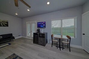 Spacious one room studio condo with king bed, tv, coffee maker, refrigerator and microwave