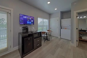 Spacious one room studio condo with king bed, tv, coffee maker, refrigerator and microwave